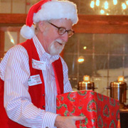 What could look more natural than Santa Claus holding a Xmas present?